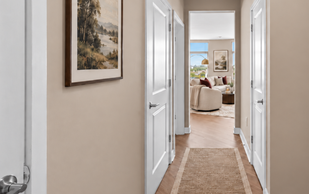 Bright apartment entry hallway with wood-style flooring at The Swift at Petworth in Washington DC.