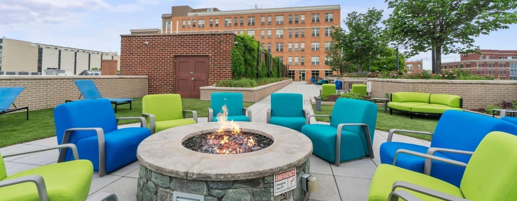 a group of chairs around a fire pit