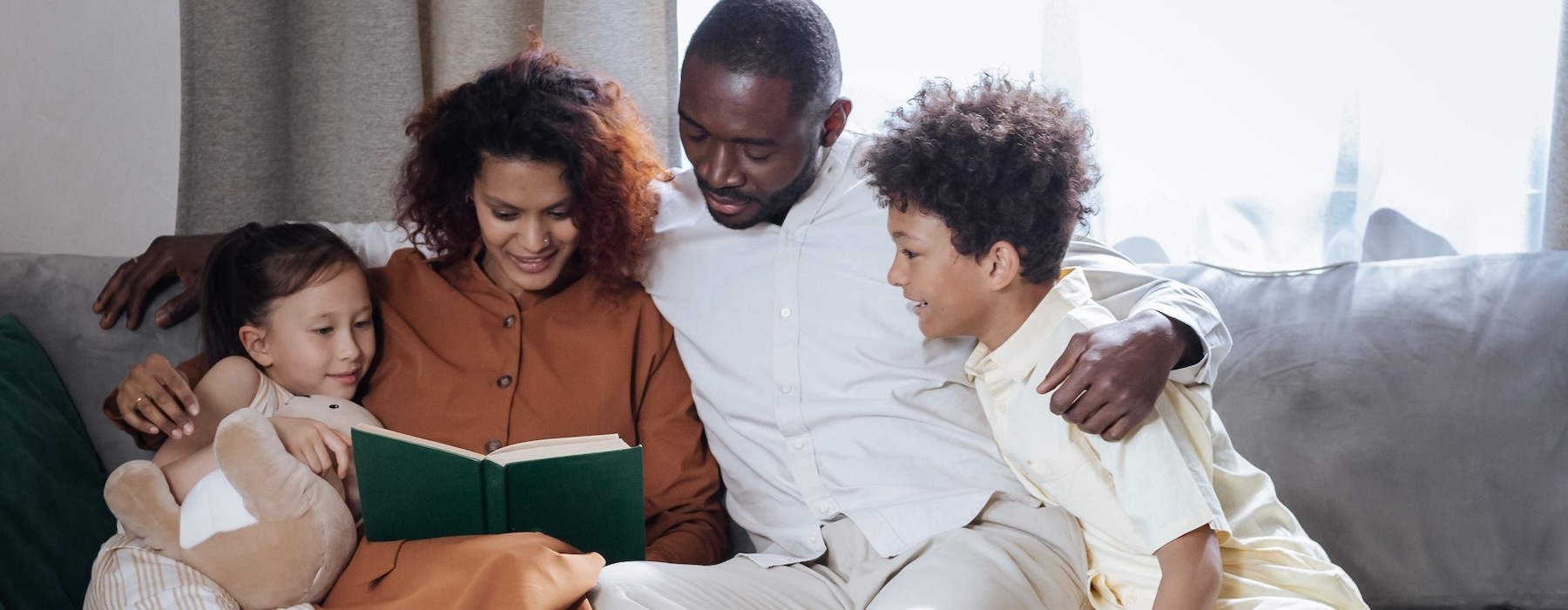 a family sitting on a couch