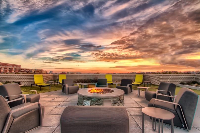 Rooftop fire pit at sunset